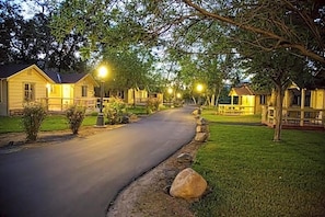 A residential street lined with houses, a paved road, and street lamps. - Wonder Valley Ranch Resort and Conference Center (Sanger)