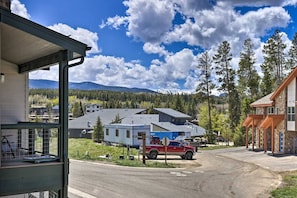 A residential area with a house, a red truck, and a clear sky. - Rendezvous Retreat | Pet Friendly with Peak Vistas | Walk to Trails (Fraser)