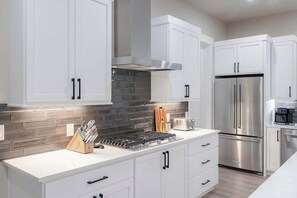 Gas stove top - Gather & Glow | Downtowan House | Private Hot Tub (Winter Park)