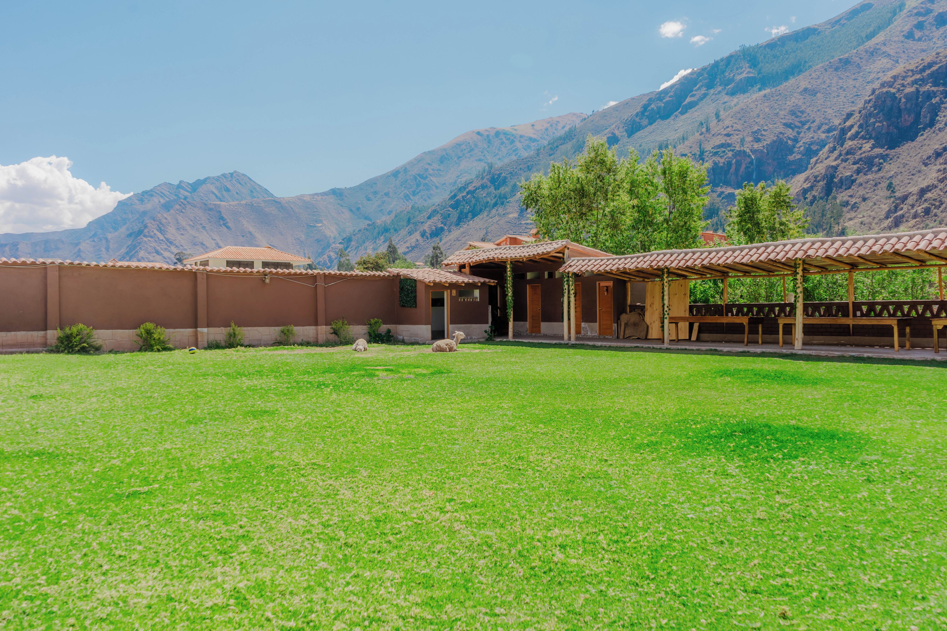 A building with a flat roof and a covered patio area.