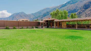 A building with a flat roof and a covered patio area.