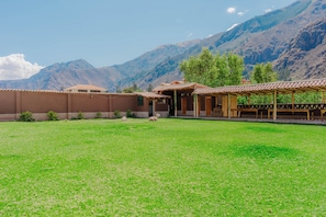 A building with a flat roof and a covered patio area.