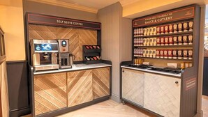A self-serve coffee station and a condiment station with labeled containers. - Charnwood Arms by Good Night Inns (Coalville)