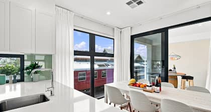 Modern 2BR Townhouse | Coastal Views, Double Garage & Steps to the Beach