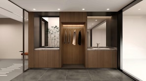 Ein modernes Badezimmer mit einem Holz-Waschtisch, einem Spiegel und einem Waschbecken.