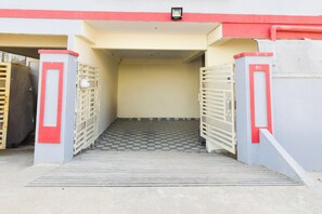 A gated entrance with a metal staircase leading to a covered area. - Hotel O Bolligudem (Hyderabad)