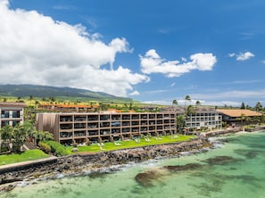 A resort with multiple-story buildings, a pool area, and a view of the ocean. - Oceanfront 1BD with Unobstructed Ocean, Lanai & Island Views & Pool -Kaleialoha 415 (Lahaina)