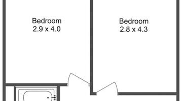 A floor plan with two bedrooms, a bathroom, a kitchen, a living area, and an entryway.