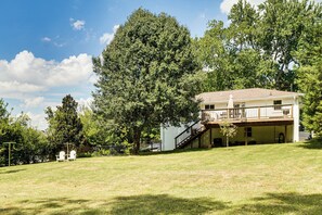 A two-story house with a covered porch and a staircase leading to the upper level. - 9 Mi to Dtwn Nashville! Updated Home + Large Yard (Nashville)
