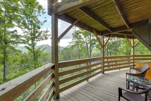 A wooden deck with a railing, overlooking a forested landscape. - 1 Mi to Sugar Mtn Resort: 'The Treehouse Lodge' (Sugar Mountain)