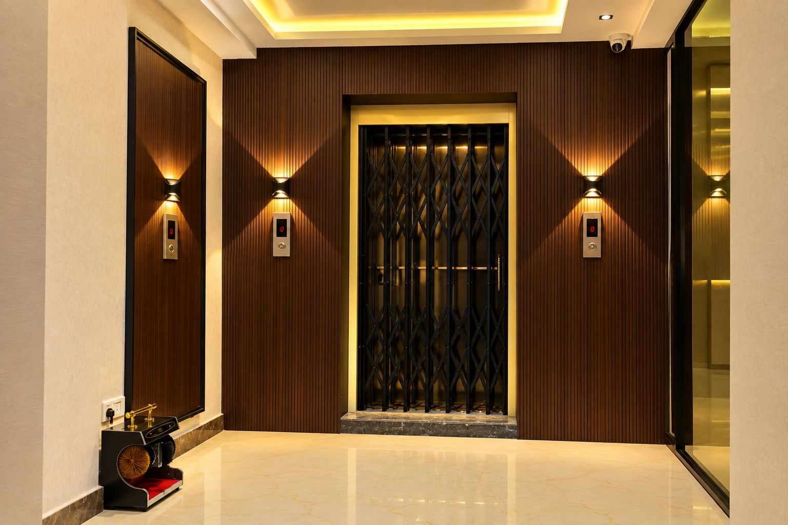 A modern elevator entrance with a digital display, wall-mounted lighting, and a polished marble floor.