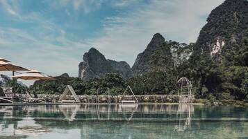 Outdoor pool, open 8:00 AM to 10:00 PM, pool umbrellas