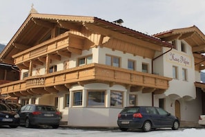 A two-story building with a balcony, labeled 'Haus Alpina.' - Top 1 in the Alpine House (Uderns)