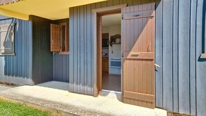 A wooden building with a door leading to a kitchen area. - AGA2 VIEW & MOUNTAIN Alpine Chalet (3 People) (Châtel)