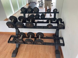 A gym with a rack of dumbbells and a person in the background. - Quiet & Cozy 1br, Pool, Rawai, Walk to Gyms (Rawai)