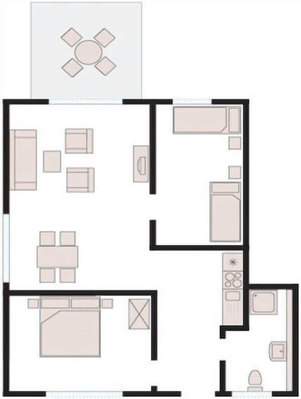 Ein Hotelzimmer mit Bett, Schreibtisch, Stuhl, einem kleinen Tisch und einem Badezimmer.