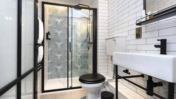 Shower, hair dryer, towels, shampoo