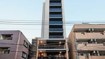 A multi-story hotel with a modern facade, large windows, and a prominent entrance.
