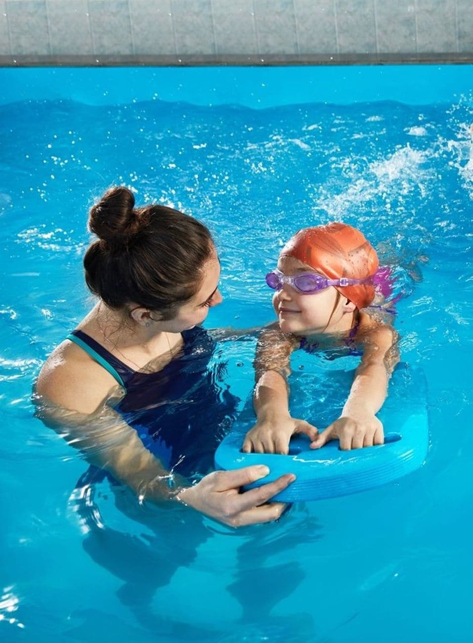 A swimming pool with clear blue water.