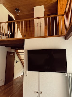 A staircase with wooden railings leading to an upper floor.