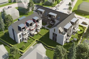 A modern residential complex with multiple two-story buildings, landscaped gardens, and a central courtyard. - Sonnengarten 21 in Kellenhusen (Kellenhusen)