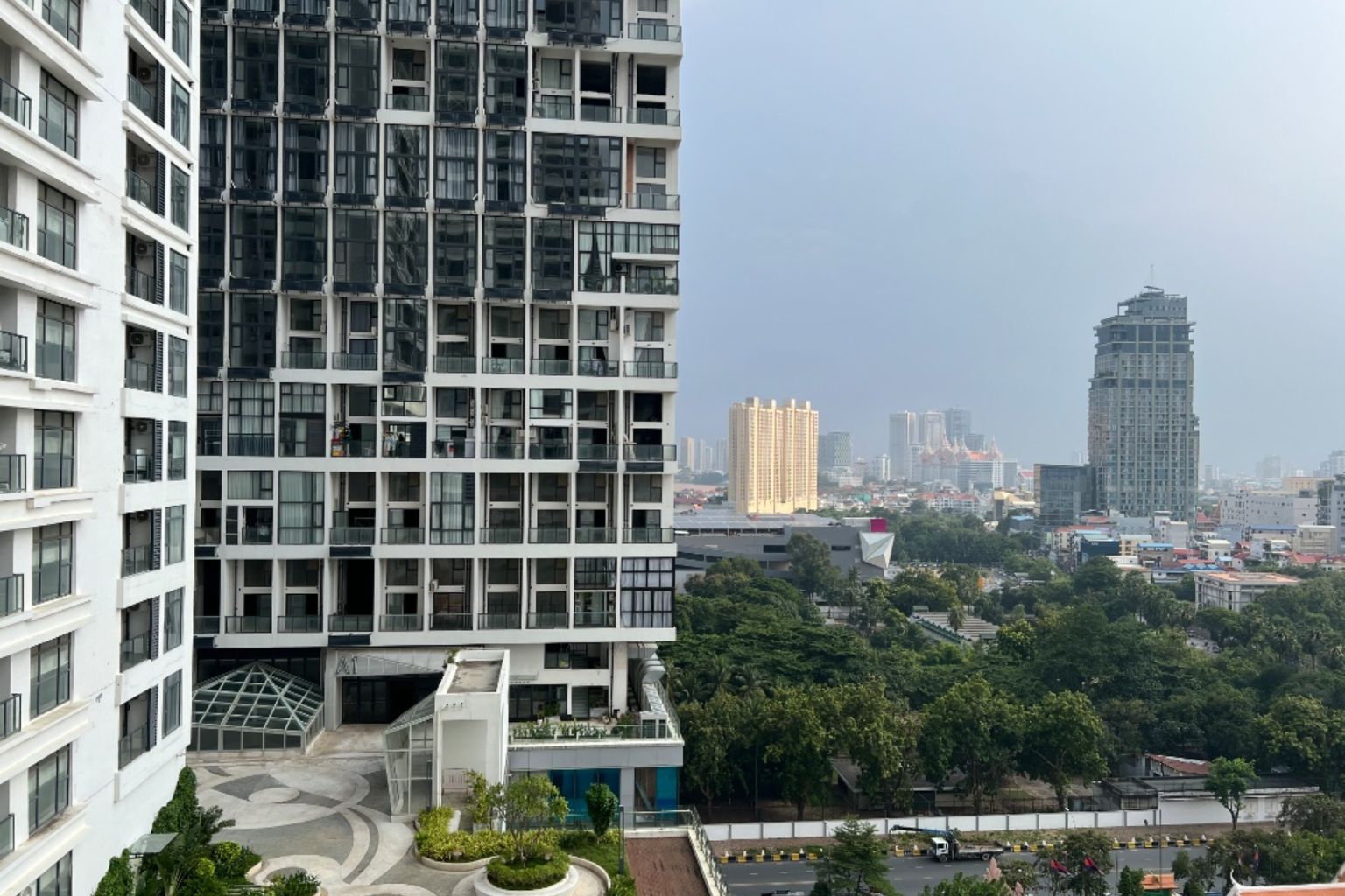 A high-rise building with multiple floors, large windows, and a modern architectural design.