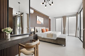 A modern hotel room with a large bed, a desk, a chair, a mirror, and a view of the outside. - Allena Villa by Kozystay - Canggu (Badung)