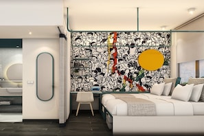 Un dormitori modern amb un llit gran, una taula de treball i una paret amb un disseny abstracte i colorit.