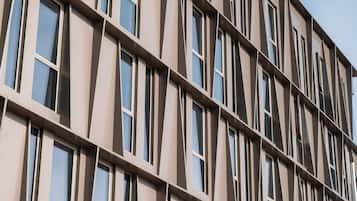 A modern building with a grid of windows and a flat facade.