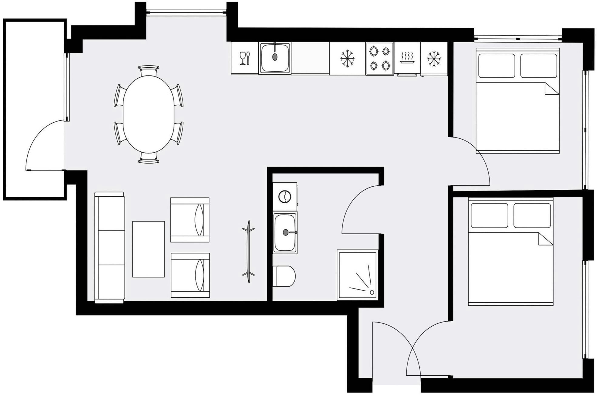 Een plattegrond met een keuken, een eetruimte en twee slaapkamers.