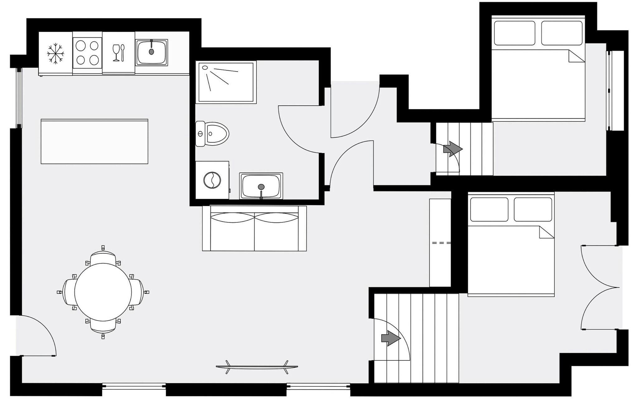 A floor plan with a kitchen, dining area, and two bedrooms.