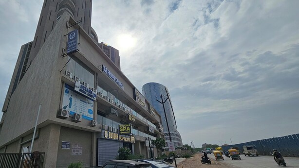 A multi-story building with a sign for 'Hotel Orion' on the second floor. - Hotel Orion  (Gandhinagar)