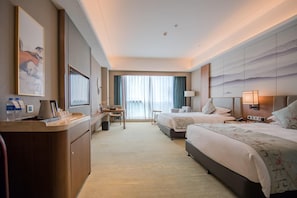 A hotel room with two beds, a desk, a chair, a large window with curtains, and a view of the cityscape. - Argyle Grand Hotel Nanping (Nanping)