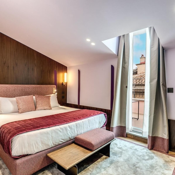 A modern bedroom with a large bed, a bedside table, a window with curtains, and a view of the outside. - THE Steps Hotel by Eitch Collection (Rome)
