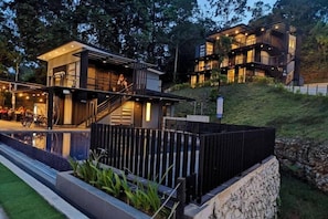 A modern two-story building with a balcony, a staircase, and a pool area. - Lilla Waterfall Retreat at Sg Lembing, Kuantan (Sungai Lembing)