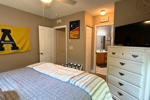 A bedroom with a bed, dresser, and a television. - 2 bed condo, Seven Devils, close to it all! (Seven Devils)