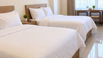 Classic Double or Twin Room, City View | Desk, laptop workspace, WiFi (free), bed sheets