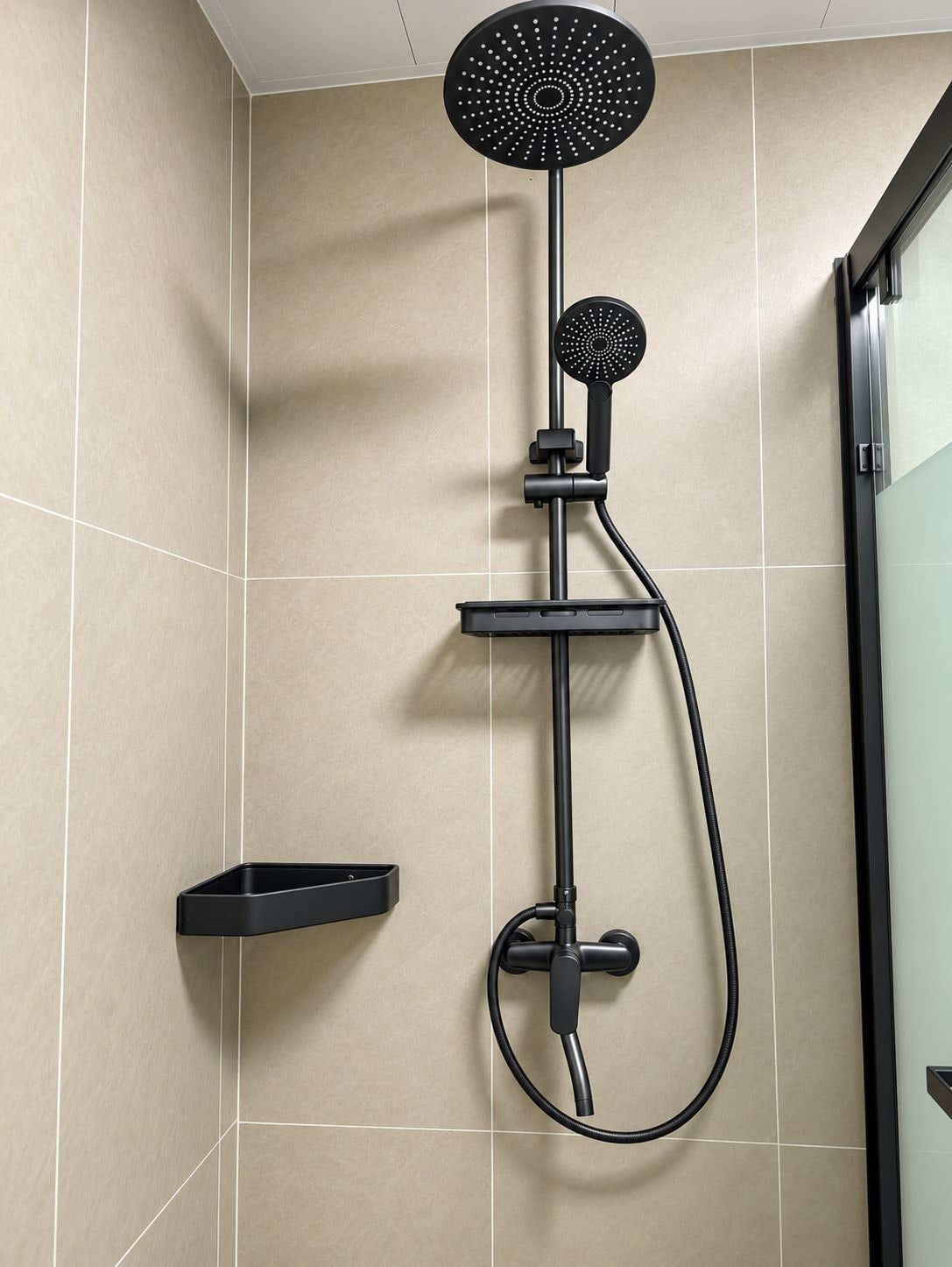 A modern shower with a handheld showerhead and a handheld massager.