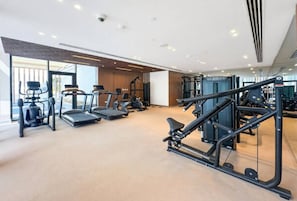 A gym with treadmills, elliptical machines, and weight equipment. - Vogue, VYB at Business Bay close to Downtown (Business Bay)