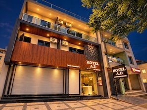 A modern hotel with a two-story structure, a visible entrance, and a sign indicating 'HOTEL A.D' with 'LUXURIOUS AC ROOMS' below. - Hotel AD (Indore)