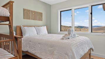 Wake to sweeping views of golden hills and open skies stretching beyond your window. Sunlight pours in to highlight the cozy comfort of your room, complete with a bunk bed for the little ones.