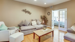 A living room with a sofa, armchair, and coffee table. - Spacious Group Getaway Near Grounds For Sculpture (Hightstown)