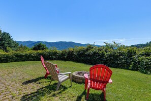 Two outdoor chairs facing a mountainous landscape. - Hiking Days, Campfire Nights! Hot Springs Hideaway (Hot Springs)