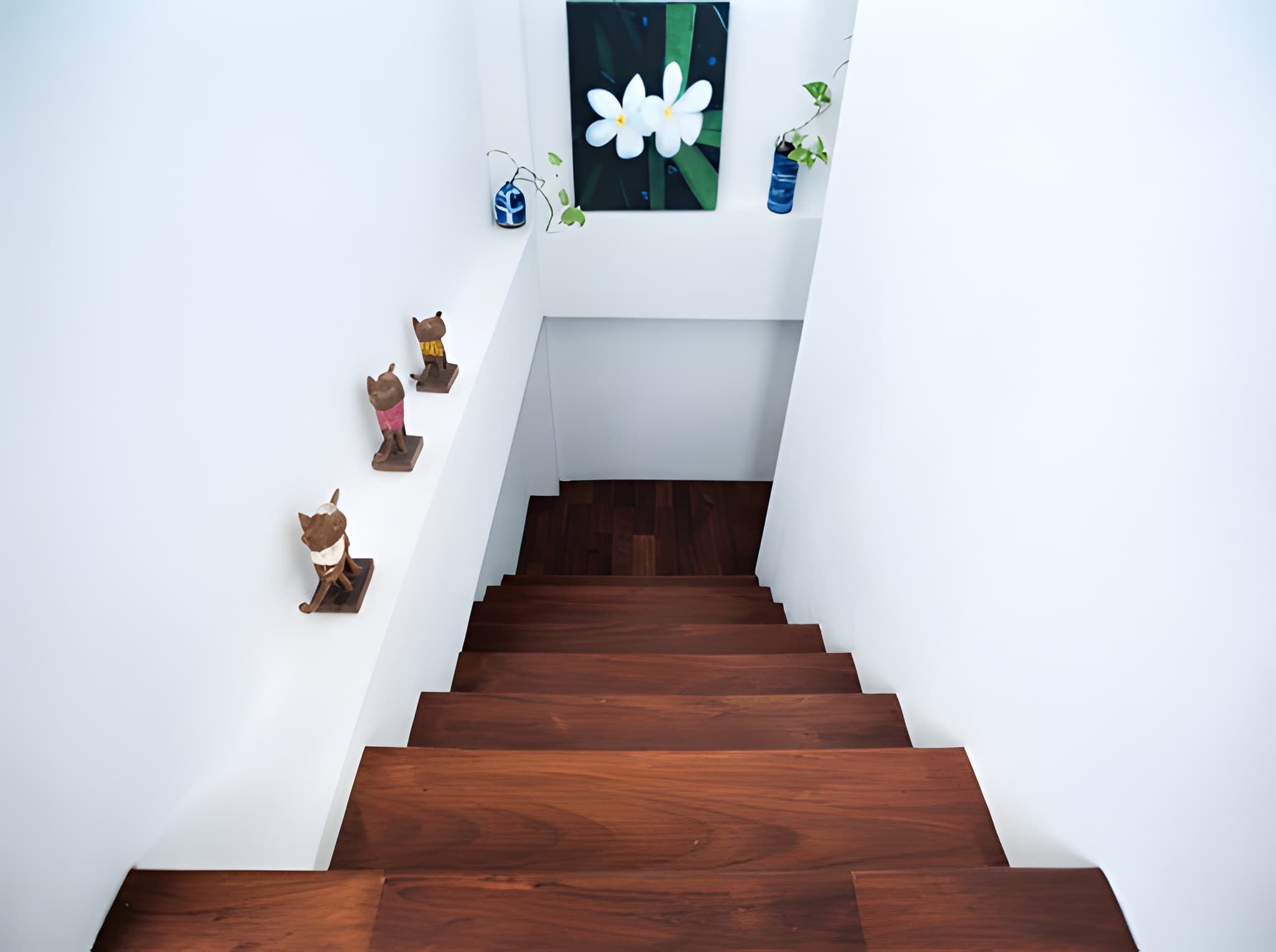 A staircase with wooden steps leading to a landing.