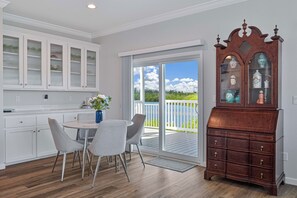 Bayshore Oasis - Dining area with sliding doors to the large porch overlooking the bay - Waterfront Bonita Springs Retreat with Boat Dock & Estero Bay & Gulf Access (Bonita Springs)