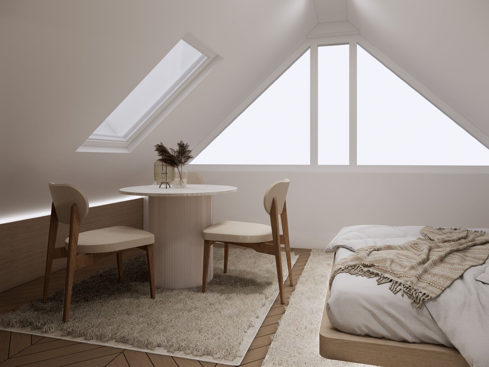 Ein Schlafzimmer mit einem Bett, einem runden Tisch, zwei Stühlen und einem Oberlicht.