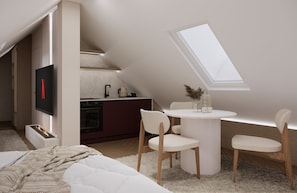 Ein modernes Schlafzimmer im Loft-Stil mit integrierter Küche, Kamin und Dachfenster.