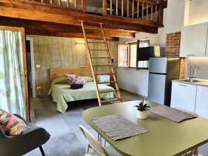 A compact kitchen with a refrigerator, sink, and wooden ceiling. - Studio at Agriturismo al Campo del Nocciolo in the countryside with Maira Valley view (Busca)
