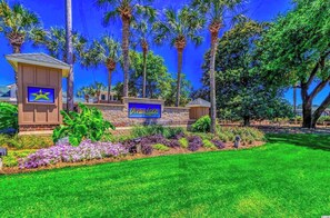A hotel entrance with a sign reading "Ocean Lakes." - Beautiful 3 Bedroom 2 full bath overlooking Sandlapper lake site S2 Ocean Lakes (Myrtle Beach)