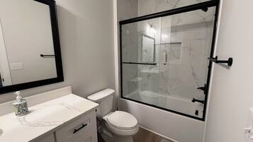 Shower, towels, soap, toilet paper